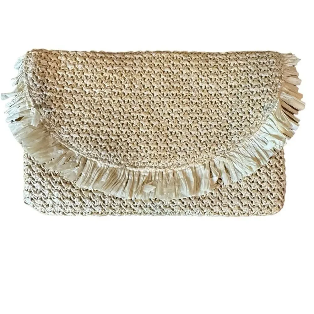 The North Shore Natural Frayed Tassel Clutch
